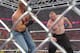 Triple H and Brock Lesnar inside a steel cage on Raw. (Photo credit: WWE.com)