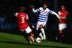 LONDON, ENGLAND - MAY 04: Armand Traore (C) of Queens Park Rangers holds off the challenge of Bacary Sagna (L) and Theo Walcott (R) of Arsenal during the Barclays Premier League match between Queens Park Rangers and Arsenal at Loftus Road on May 04, 2013 in London, England. (Photo by Clive Rose/Getty Images)