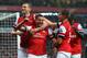 LONDON, ENGLAND - MAY 14: Lukas Podolski (2nd left) of Arsenal celebrates with team mates after scoring during the Barclays Premier League match between Arsenal and Wigan Athletic at Emirates Stadium on May 14, 2013 in London, England. (Photo by Shaun Botterill/Getty Images)