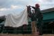 BALTIMORE, MD - MAY 15: Kentucky Derby winner Orb gets a blanket put on him by exercise rider Jennifer Patterson and trainer Shug McGaughey
following a workout in preparation for the 138th Preakness Stakes at Pimlico Race Course on May 15, 2013 in Baltimore, Maryland. (Photo by Rob Carr/Getty Images)
