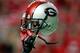 ATLANTA, GA - SEPTEMBER 03: A player holds up a Georgia Bulldogs helmet before the game against the Boise State Broncos at Georgia Dome on September 3, 2011 in Atlanta, Georgia. (Photo by Kevin C. Cox/Getty Images)