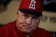 HOUSTON, TX - MAY 09: Manager Mike Scioscia of the Los Angeles Angels of Anaheim speaks with a group of reporters in the dugout before the start of the game against the Houston Astros at Minute Maid Park on May 9, 2013 in Houston, Texas. (Photo by Scott Halleran/Getty Images)
