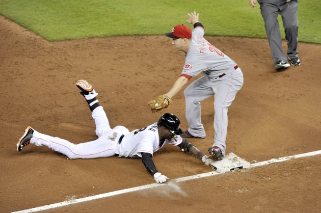 Miami Marlins' Late Rally Spoiled by Reds in 10th Inning Loss