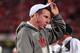 COLUMBUS, OH - OCTOBER 6: Head Coach Bo Pelini of the Nebraska Cornhuskers checks on one of his injured players during a game against the Ohio State Buckeyes at Ohio Stadium on October 6, 2012 in Columbus, Ohio. Ohio State defeated Nebraska 63-38. (Photo by Jamie Sabau/Getty Images)