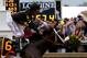 BALTIMORE, MD - MAY 18: Gary Stevens celebrates atop of Oxbow #6 as he crosses the finish line to win the 138th running of the Preakness Stakes at Pimlico Race Course on May 18, 2013 in Baltimore, Maryland. (Photo by Justin Heiman/Getty Images)