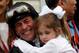 BALTIMORE, MD - MAY 18: (L-R) Jockey Gary Stevens hugs his daughter Madison in the Winner's Circle after riding Oxbow #6 to win the 138th running of the Preakness Stakes at Pimlico Race Course on May 18, 2013 in Baltimore, Maryland. (Photo by Rob Carr/Getty Images)