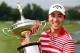 IRVING, TX - MAY 19: Sang-Moon Bae of South Korea celebrates with the championship trophy after winning the 2013 HP Byron Nelson Championship at the TPC Four Seasons Resort on May 19, 2013 in Irving, Texas. (Photo by Tom Pennington/Getty Images)