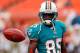 MIAMI GARDENS, FL - AUGUST 10: Receiver Chad Johnson #85 of the Miami Dolphins warms up just before the start of the NFL Preseason Game against the Tampa Bay Buccaneers at Sun Life Stadium on August 10, 2012 in Miami Gardens, Florida. (Photo by J. Meric/Getty Images)