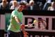 ROME, ITALY - MAY 19: Roger Federer of Switzerland plays a backhand against Rafael Nadal of Spain in their final match during day eight of the Internazionali BNL d'Italia 2013 at the Foro Italico Tennis Centre on May 19, 2013 in Rome, Italy. (Photo by Clive Brunskill/Getty Images)