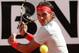 ROME, ITALY - MAY 19: Rafael Nadal of Spain plays a backhand against Roger Federer of Switzerland in their final match during day eight of the Internazionali BNL d'Italia 2013 at the Foro Italico Tennis Centre on May 19, 2013 in Rome, Italy. (Photo by Clive Brunskill/Getty Images)