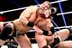 The re-debuting Curtis Axel takes control of Triple H. (Courtesy of WWE.com)
