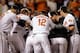 BALTIMORE, MD - MAY 21: Nate McLouth #9 of the Baltimore Orioles is mobbed at the plate after hitting a walk off home run to give the Orioles a 3-2 win over the New York Yankees in the tenth inning at Oriole Park at Camden Yards on May 21, 2013 in Baltimore, Maryland. (Photo by Rob Carr/Getty Images)