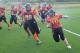 Graves (donning number 80) chasing down a member of the Capital Area Lady Gladiators