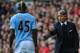 LIVERPOOL, ENGLAND - AUGUST 26: Manchester City Manager Roberto Mancini gives instructions to Mario Balotelli of Manchester City during the Barclays Premier League match between Liverpool and Manchester City at Anfield on August 26, 2012 in Liverpool, England. (Photo by Michael Regan/Getty Images)