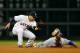 HOUSTON, TX - MAY 21: Alex Gordon #4 of the Kansas City Royals is caught stealing second base during the fourth inning by Jose Altuve #27 of the Houston Astros at Minute Maid Park on May 21, 2013 in Houston, Texas. (Photo by Scott Halleran/Getty Images)