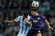 MALAGA, SPAIN - MARCH 13: Julio C. Baptista of Malaga CF (L) competes for the ball with Joao Moutinho (R) of FC Porto during the UEFA Champions League Round of 16 second leg match between Malaga CF and FC Porto at La Rosaleda Stadium on March 13, 2013 in Malaga, Spain. (Photo by Gonzalo Arroyo Moreno/Getty Images)
