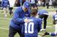 Jan 8, 2011; East Rutherford, NJ, USA; New York Giants head coach Tom Coughlin pats New York Giants quarterback Eli Manning (10) on the back during pre game warmups before playing the Atlanta Falcons in the NFC Wildcard game at MetLife Stadium. Mandatory Credit: Andrew Mills/THE STAR-LEDGER via USA TODAY Sports