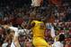 Mar 6, 2013; Lincoln, NE, USA; Minnesota Golden Gophers forward Trevor Mbakwe (32) goes to the hoop against Nebraska Cornhuskers forward Brandon Ubel (13) and guard Shavon Shields (31) in the second half at the Bob Devaney Sports Center. Nebraska won 53-51. Mandatory Credit: Bruce Thorson-USA TODAY Sports