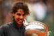PARIS, FRANCE - JUNE 11: Rafael Nadal of Spain celebrates victory with the Coupe des Mousquetaires trophy in the men's singles final against Novak Djokovic of Serbia during day 16 of the French Open at Roland Garros on June 11, 2012 in Paris, France. (Photo by Clive Brunskill/Getty Images)