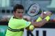 ROME, ITALY - MAY 13: Milos Raonic of Canada plays a backhand against Philipp Kohlschreiber of Germany in their first round match during day two of the Internazionali BNL d'Italia 2013 at the Foro Italico Tennis Centre on May 13, 2013 in Rome, Italy. (Photo by Clive Brunskill/Getty Images)