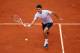 PARIS, FRANCE - MAY 26: Roger Federer of Switzerland plays a forehand during his Men's Singles match against Pablo Carreno-Busta of Spain during day one of the French Open at Roland Garros on May 26, 2013 in Paris, France. (Photo by Clive Brunskill/Getty Images)