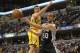 Nov. 23, 2012; Indianapolis, IN, USA; San Antonio Spurs shooting guard Manu Ginobili (20) passes the ball under the basket against the Indiana Pacers during the second half at Bankers Life Fieldhouse. The Spurs won 104-97. Mandatory Credit: Pat Lovell-USA TODAY Sports