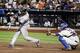 NEW YORK, NY - JUNE 24: Robinson Cano #24 of the New York Yankees hits a solo home run in the eighth inning as Josh Thole #30 of the New York Mets on June 24, 2012 during interleague play at Citi Field in the Flushing neighborhood of the Queens borough of New York City. (Photo by Elsa/Getty Images)