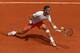 PARIS, FRANCE - MAY 27: Rafael Nadal of Spain plays a forehand in his Men's Singles match against Daniel Brands of Germany during day two of the French Open at Roland Garros on May 27, 2013 in Paris, France. (Photo by Matthew Stockman/Getty Images)