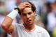 PARIS, FRANCE - MAY 27: Rafael Nadal of Spain holds his head during his Men's Singles match against Daniel Brands of Germany during day two of the French Open at Roland Garros on May 27, 2013 in Paris, France. (Photo by Getty Images/Getty Images)