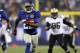 EAST RUTHERFORD, NJ - DECEMBER 09: David Wilson #22 of the New York Giants carries the ball past Isa Abdul-Quddus #42 of the New Orleans Saints to score his third touchdown of the game on December 9, 2012 at MetLife Stadium in East Rutherford, New Jersey. (Photo by Elsa/Getty Images)