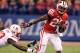 Dec 1, 2012; Indianapolis, IN, USA; Wisconsin Badgers running back Melvin Gordon (25) escapes a tackle by Nebraska Cornhuskers safety P.J. Smith (13) and breaks for a touchdown run during the Big Ten championship game at Lucas Oil Stadium. Mandatory Credit: Brian Spurlock-USA TODAY Sports
