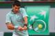 PARIS, FRANCE - MAY 28: Novak Djokovic of Serbia plays a backhand in his Men's Singles match against David Goffin of Belgium during day three of the French Open at Roland Garros on May 28, 2013 in Paris, France. (Photo by Julian Finney/Getty Images)