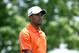 May 30, 2013; Dublin, OH, USA; Tiger Woods reacts after playing his tee shot on the fifth hole during the first round of The Memorial Tournament at Muirfield Village Golf Club. Mandatory Credit: Allan Henry-USA TODAY Sports