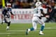 FOXBORO, MA - DECEMBER 30: Lamar Miller #26 of the Miami Dolphins bobbles a pass before securing the catch against the New England Patriots during the game at Gillette Stadium on December 30, 2012 in Foxboro, Massachusetts. (Photo by Jared Wickerham/Getty Images)