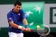 PARIS, FRANCE - MAY 30: Novak Djokovic of Serbia plays a backhand in his Men's Singles match against Guido Pella of Argentina during day five of the French Open at Roland Garros on May 30, 2013 in Paris, France. (Photo by Clive Brunskill/Getty Images)