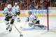 Jun 1, 2013; Chicago, IL, USA; Los Angeles Kings center Anze Kopitar (11) clears the puck away from goalie Jonathan Quick (32) during the first period in game one of the Western Conference finals of the 2013 Stanley Cup Playoffs against the Chicago Blackhawks at the United Center. Mandatory Credit: Rob Grabowski-USA TODAY Sports