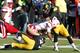 IOWA CITY, IA - NOVEMBER 23: Running back Braylon Heard #5 of the Nebraska Cornhuskers rushes up field during the third quarter against defensive back Micah Hyde #18 and John Lowdermilk #37 of the Iowa Hawkeyes on November 23, 2012 at Kinnick Stadium in Iowa City, Iowa. Nebraska defeated Iowa 13-7. (Photo by Matthew Holst/Getty Images)