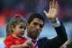 LIVERPOOL, ENGLAND - MAY 19: Luis Suarez of Liverpool performs a lap of honour with daughter Delfina after the Barclays Premier League match between Liverpool and Queens Park Rangers at Anfield on May 19, 2013 in Liverpool, England. (Photo by Julian Finney/Getty Images)