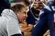 Bill Belichick coaching up his defense on the sideline.