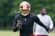 May 23, 2013; Ashburn, VA, USA; Washington Redskins quarterback Robert Griffin III (10) warms up on the field during organized team activities at Redskins Park. Mandatory Credit: Geoff Burke-USA TODAY Sports