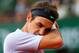 PARIS, FRANCE - JUNE 02: Roger Federer of Switzerland wipes his face in his Men's Singles match against Gilles Simon of France during day eight of the French Open at Roland Garros on June 2, 2013 in Paris, France. (Photo by Julian Finney/Getty Images)