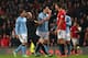 Gareth Barry having a calm, friendly discussion with Rio Ferdinand.