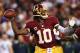 LANDOVER, MD - JANUARY 06: Robert Griffin III #10 of the Washington Redskins drops back to pass against the Seattle Seahawks during the NFC Wild Card Playoff Game at FedExField on January 6, 2013 in Landover, Maryland. (Photo by Win McNamee/Getty Images)