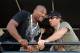 CONCORD, NC - MAY 30: Actors Sharlto Copley (R) and Quinton 'Rampage' Jackson talk in the #39 U.S. Army Chevrolet pit box prior to the NASCAR Sprint Cup Series Coca-Cola 600 at Charlotte Motor Speedway on May 30, 2010 in Concord, North Carolina. (Photo by Rusty Jarrett/Getty Images for NASCAR)