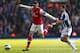 WEST BROMWICH, ENGLAND - APRIL 06: Laurent Koscielny (L) of Arsenal steps away from Shane Long (R) of West Bromwich Albion during the Barclays Premier League match between West Bromwich Albion and Arsenal at The Hawthorns on April 6, 2013 in West Bromwich, England. (Photo by Michael Steele/Getty Images)