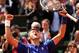 PARIS, FRANCE - JUNE 03: Novak Djokovic of Serbia celebrates match point in his Men's Singles match against Philipp Kohlschreiber of Germany on day nine of the French Open at Roland Garros on June 3, 2013 in Paris, France. (Photo by Matthew Stockman/Getty Images)