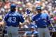 SAN FRANCISCO, CA - JUNE 05: R.A. Dickey #43 of the Toronto Blue Jays is congratulated by Mark DeRosa #16 after Dickey scored in the fifth inning of their game against the San Francisco Giants at AT&T Park on June 5, 2013 in San Francisco, California. (Photo by Ezra Shaw/Getty Images)
