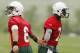 May 22, 2013; Florham Park, NJ, USA; New York Jets quarterback Mark Sanchez (left) greets teammate Geno Smith (right) during organized team activities at the New York Jets training facility. Mandatory Credit: William Perlman/THE STAR-LEDGER via USA TODAY Sports