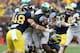 ANN ARBOR, MI - OCTOBER 20: Le'Veon Bell #24 of the Michigan State Spartans runs for a short gain as Desmond Morgan #48 of the Michigan Wolverines makes the stop during the game at Michigan Stadium on October 20, 2012 in Ann Arbor, Michigan. The Wolvereines defeated the Spartans 12-10. (Photo by Leon Halip/Getty Images)