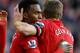 LIVERPOOL, ENGLAND - FEBRUARY 17: Daniel Sturridge of Liverpool celebrates with Steven Gerrard after scoring the fifth goal from the penalty spot during the Barclays Premier League match between Liverpool and Swansea City at Anfield on February 17, 2013 in Liverpool, England. (Photo by Clive Brunskill/Getty Images)